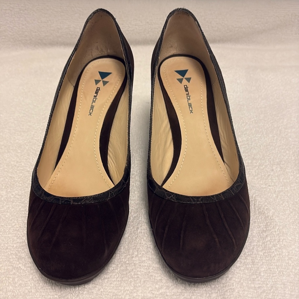 Brown pumps by Dani black, size 7.